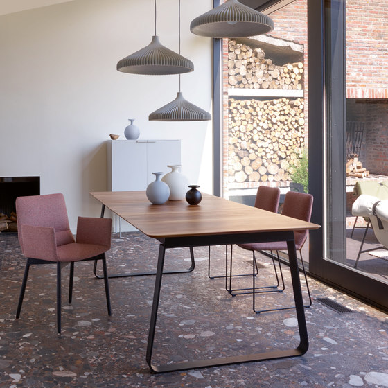 Vilna | Dining Table With Integral Extension Black Lacquered Base by Ligne Roset