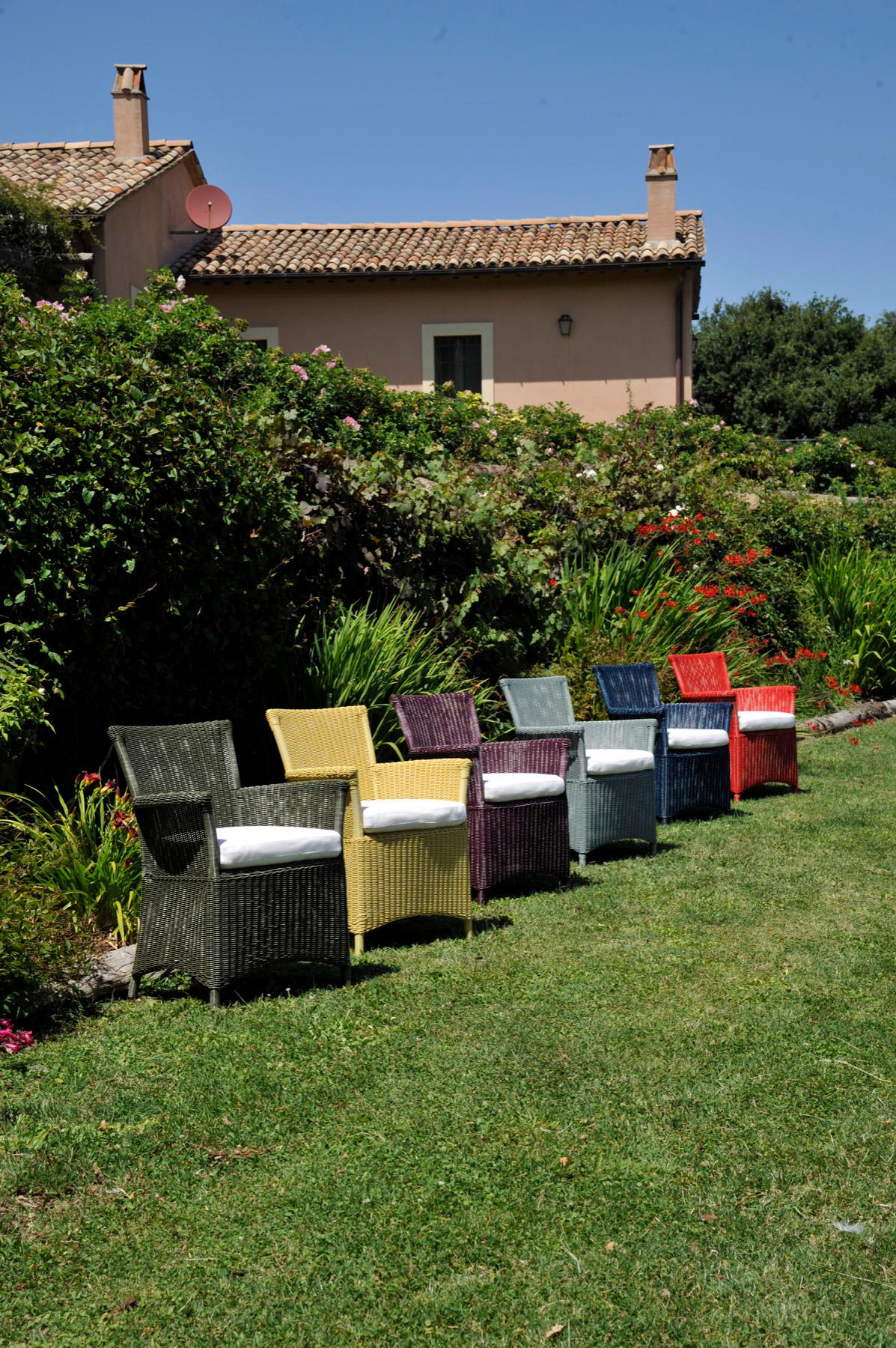 Capri outdoor armchairs in coloured fibre