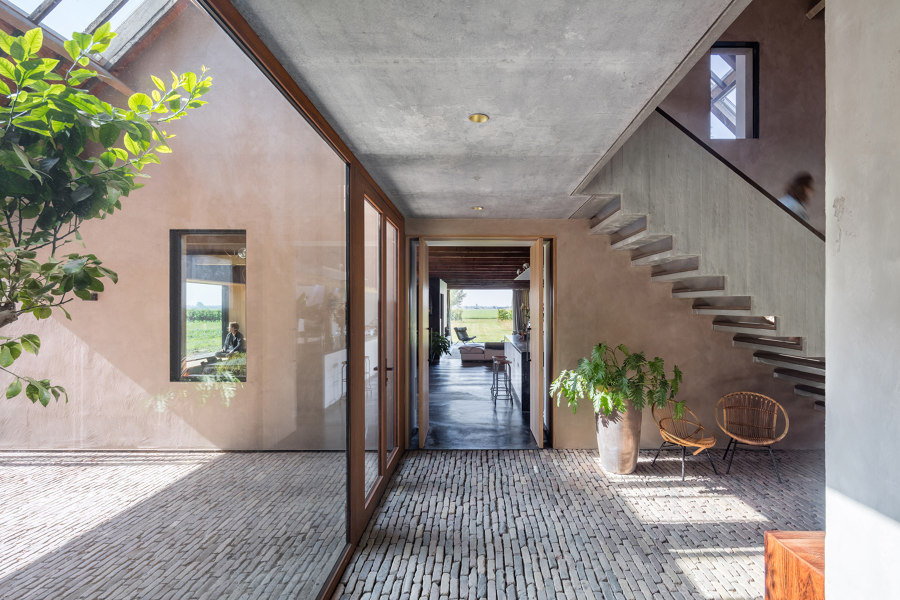 Elegant Pivot Doors in Exclusive Farmhouse by FritsJurgens | Manufacturer references