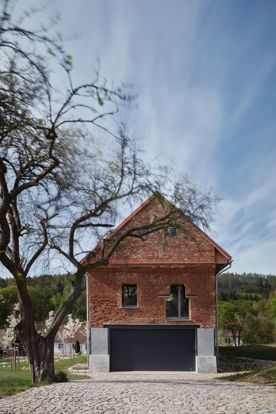 House Inside a Ruin by ORA | Detached houses