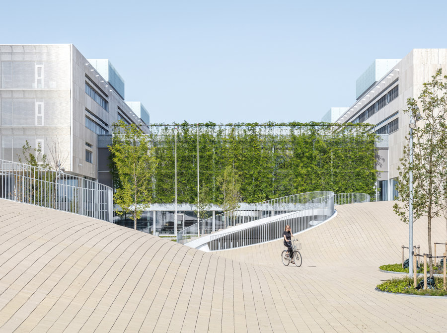 Bicycle parking under the hills by COBE | Industrial buildings