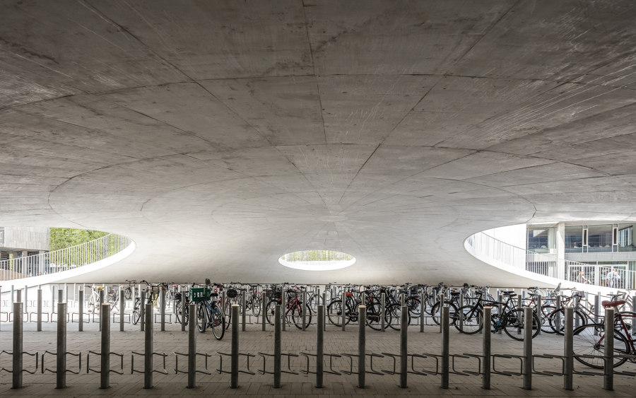 Bicycle parking under the hills by COBE | Industrial buildings