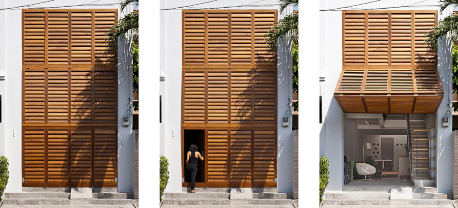 Townhouse with a Folding-Up Shutter di MM++ Architects | Case bifamiliari