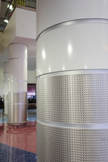 Decorative Round Steel Column Covers in McCarran Airport | Bespoke wall coverings | Moz Designs