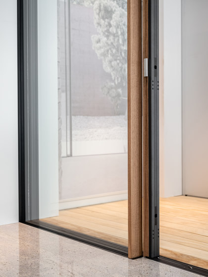 Wood frameless sliding windows with a wooden surface | Patio doors | swissFineLine