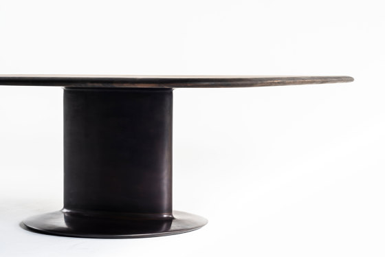 Elliptical cylinder casting bronze table | Dining tables | Time & Style