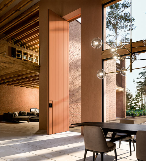 Synua | Porta blindata a bilico verticale con rivestimento in alluminio | Porte casa | Oikos – Architetture d’ingresso
