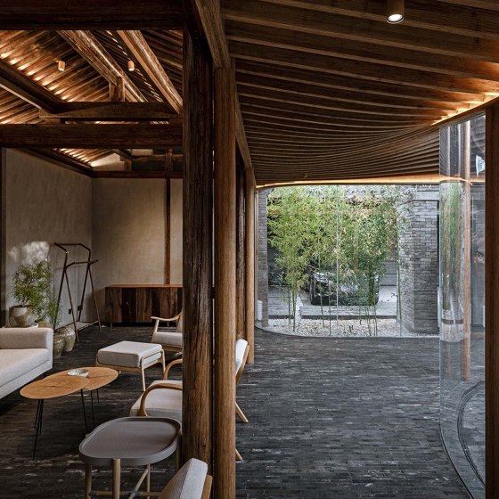 Residential courtyards that invite nature inside through glass