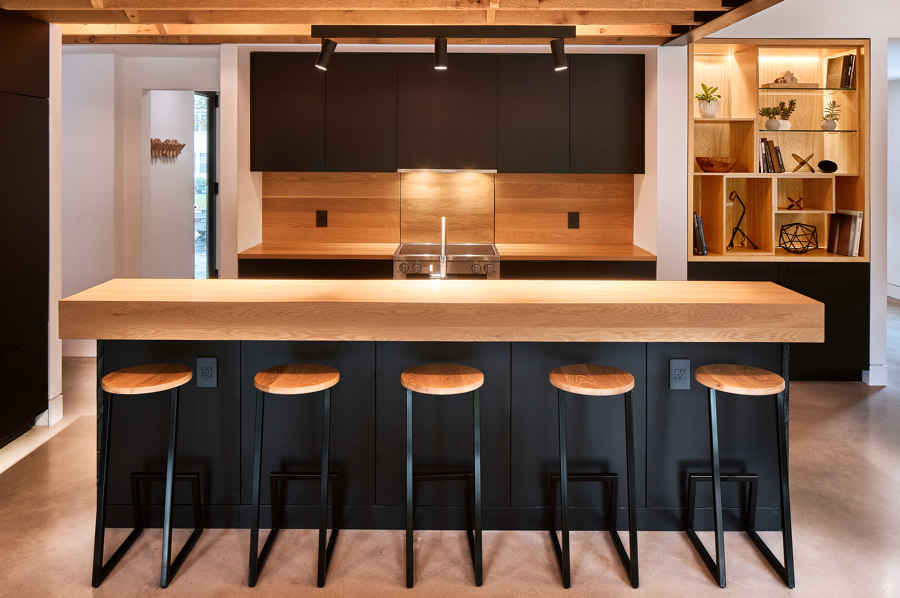 Back to black: dark kitchens that help outline open interiors | News